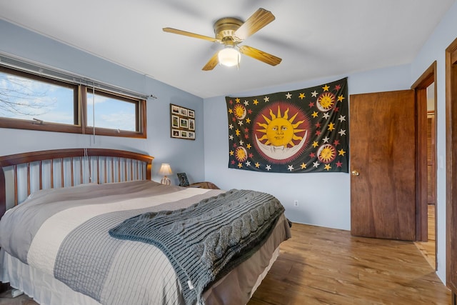13405 Ellis Rd, Conklin, MI 49403 - bedroom with wood finished floors and a ceiling fan