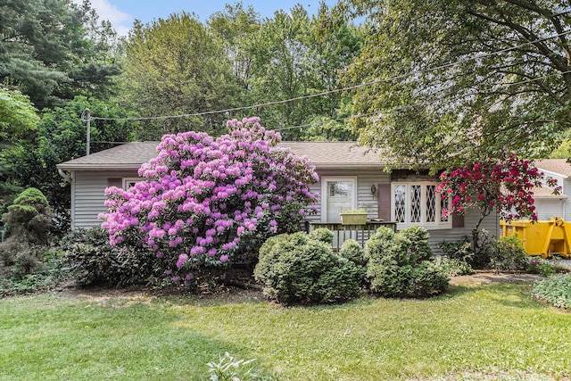 18930 G Dr N, Marshall, MI 49068 - obstructed view of property featuring a front lawn and a shingled roof