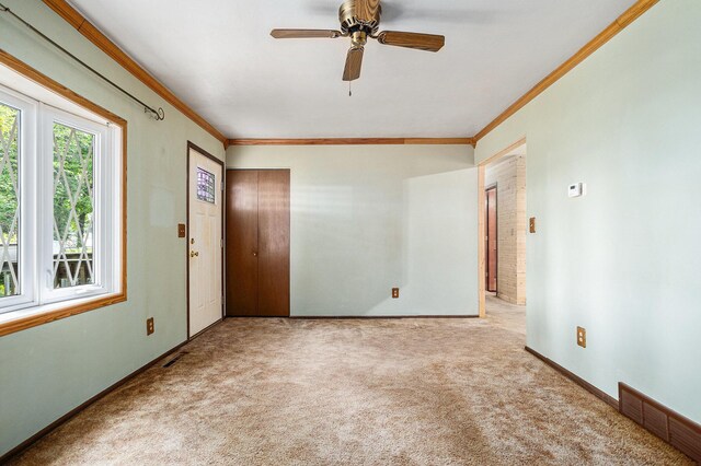 18930 G Dr N, Marshall, MI 49068 - carpeted spare room featuring crown molding, ceiling fan, and baseboards