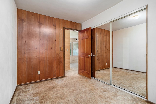 18930 G Dr N, Marshall, MI 49068 - unfurnished bedroom with carpet flooring, wooden walls, and a closet