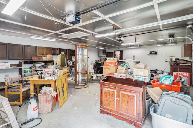 18930 G Dr N, Marshall, MI 49068 - garage with a garage door opener and a workshop area