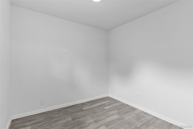 3120 Stratford St, Flint, MI 48504 - unfurnished room featuring wood finished floors and baseboards