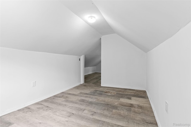 3120 Stratford St, Flint, MI 48504 - bonus room featuring vaulted ceiling, wood finished floors, and baseboards