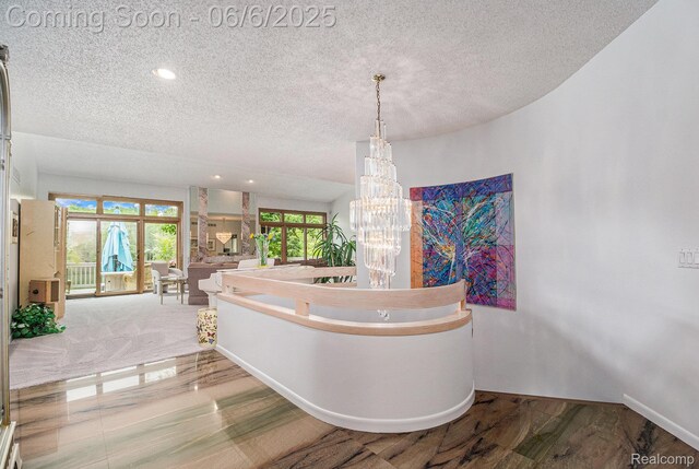4825 Mirror Lake Dr, West Bloomfield, MI 48323 - corridor with a textured ceiling, recessed lighting, a chandelier, and baseboards