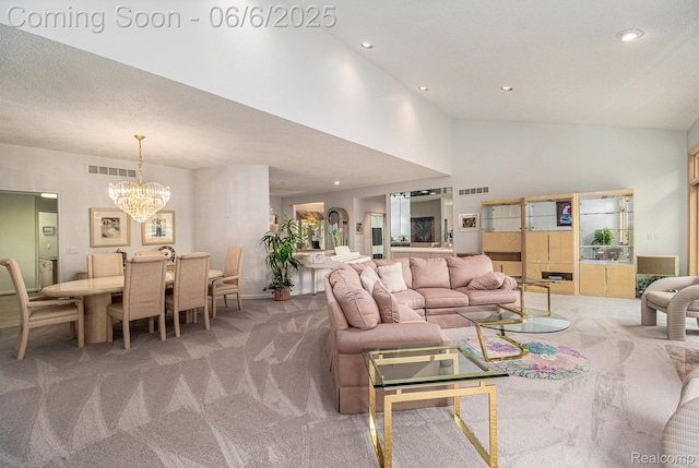 4825 Mirror Lake Dr, West Bloomfield, MI 48323 - carpeted living area with a chandelier, recessed lighting, and high vaulted ceiling