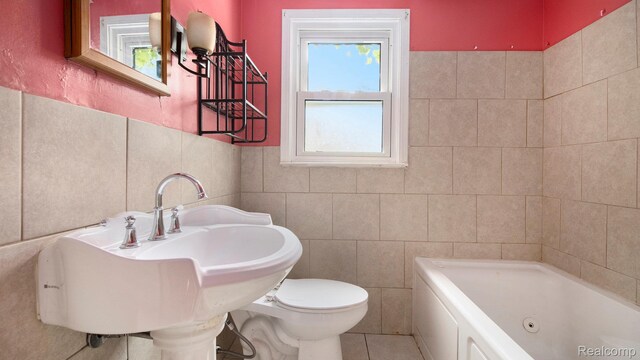 25695 Orchard Dr, Dearborn Heights, MI 48125 - full bathroom featuring tile walls, a tub with jets, and tile patterned flooring