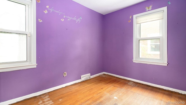 25695 Orchard Dr, Dearborn Heights, MI 48125 - spare room featuring baseboards and light wood-style flooring