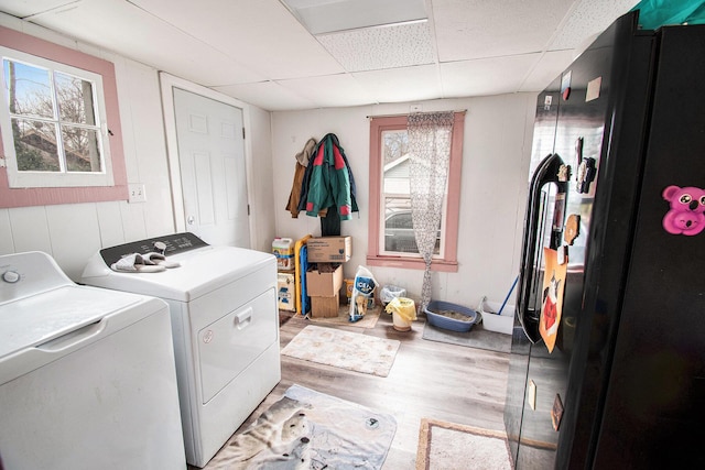 1527 Madison St, Muskegon, MI 49442 - washroom with washer and clothes dryer and light wood-style floors