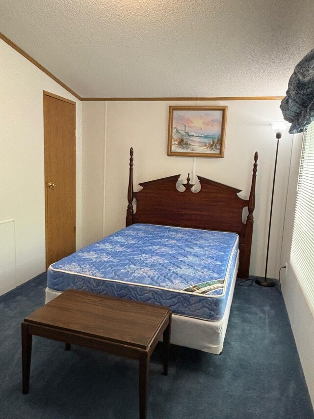530 N June Dr, Mears, MI 49436 - bedroom with a textured ceiling, carpet floors, crown molding, and lofted ceiling