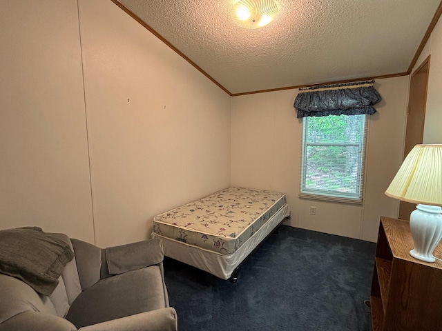 530 N June Dr, Mears, MI 49436 - bedroom with dark colored carpet, a textured ceiling, and crown molding