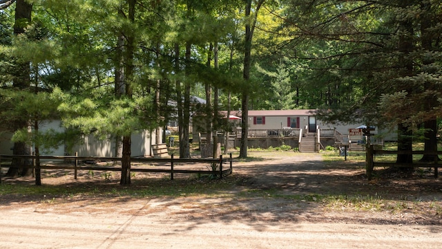 530 N June Dr, Mears, MI 49436 - view of yard with a deck and stairway