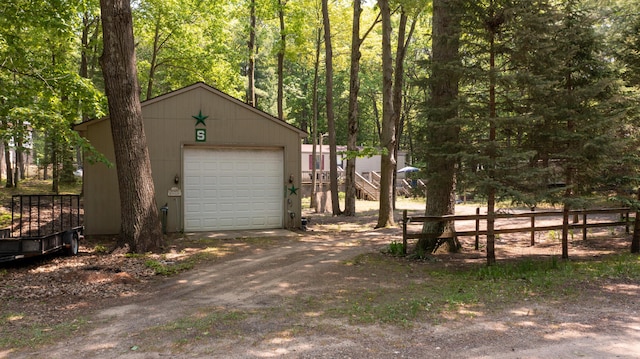 530 N June Dr, Mears, MI 49436 - detached garage featuring driveway