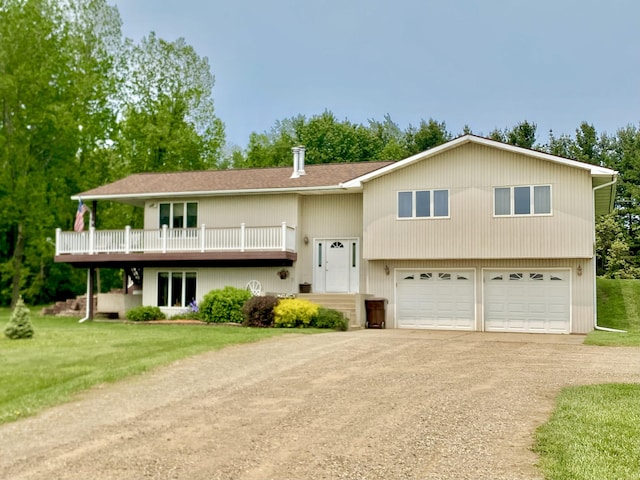 3561 Barber Rd, Hastings, MI 49058 - raised ranch featuring driveway, a front yard, and an attached garage