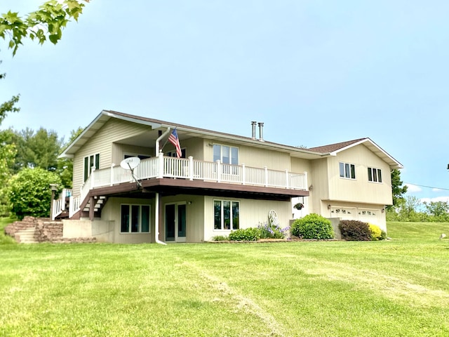 3561 Barber Rd, Hastings, MI 49058 - rear view of house featuring an attached garage, a yard, and a wooden deck