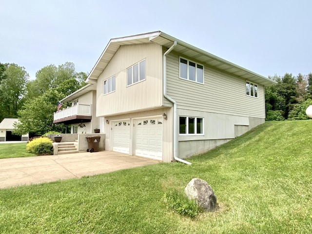 3561 Barber Rd, Hastings, MI 49058 - view of side of home featuring a garage, concrete driveway, and a yard