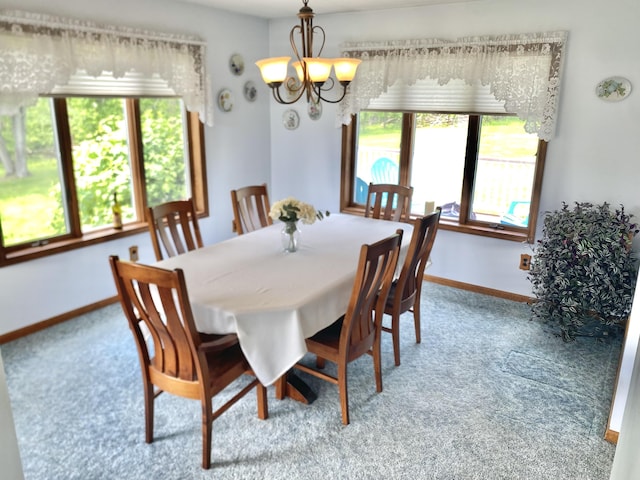 3561 Barber Rd, Hastings, MI 49058 - dining area featuring carpet flooring, healthy amount of natural light, and a chandelier