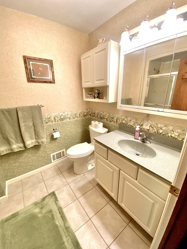 3561 Barber Rd, Hastings, MI 49058 - full bathroom with tile patterned floors, vanity, a stall shower, and toilet