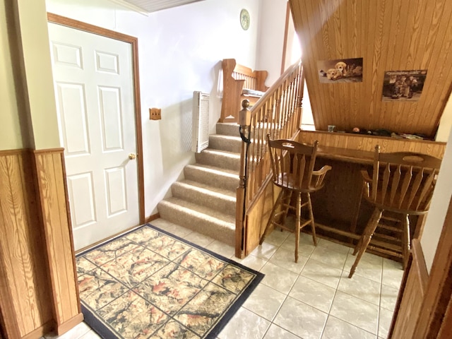 3561 Barber Rd, Hastings, MI 49058 - staircase featuring a dry bar and tile patterned floors