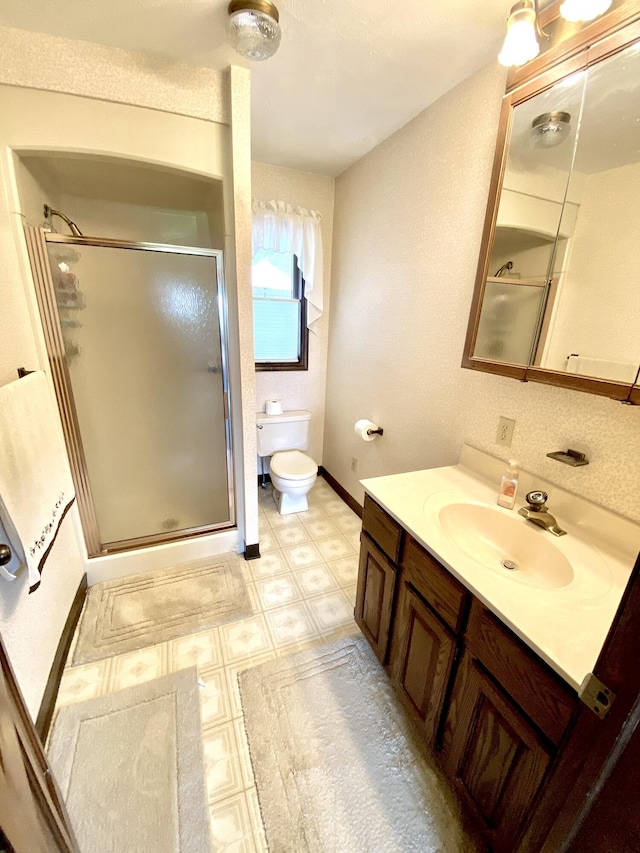 3561 Barber Rd, Hastings, MI 49058 - full bath featuring tile patterned floors, vanity, a shower stall, and toilet