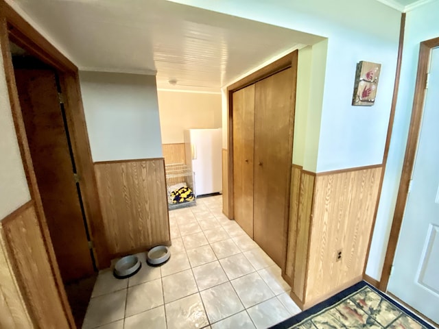 3561 Barber Rd, Hastings, MI 49058 - hallway with wainscoting, wood walls, ornamental molding, and light tile patterned floors