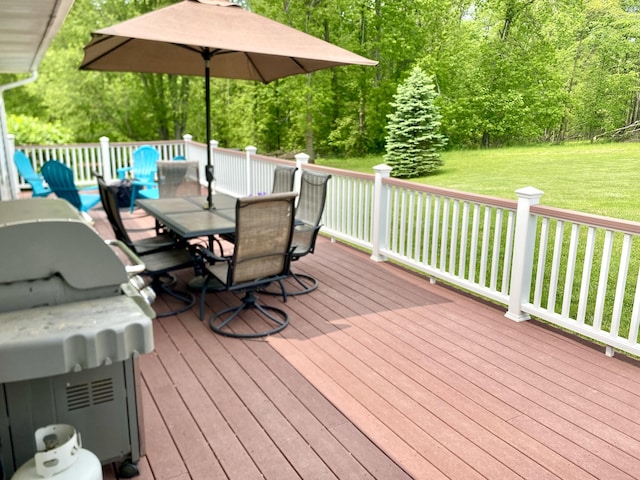 3561 Barber Rd, Hastings, MI 49058 - wooden terrace featuring outdoor dining area, a yard, and area for grilling