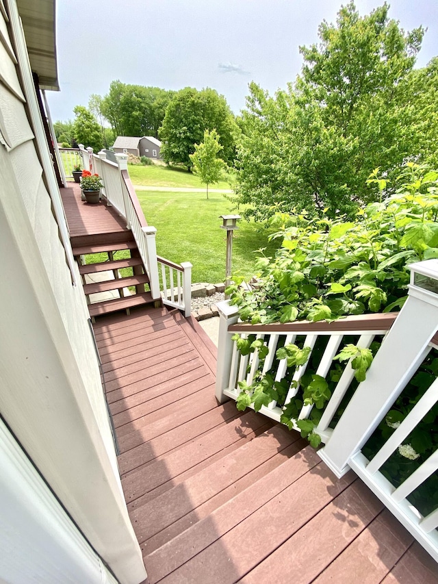 3561 Barber Rd, Hastings, MI 49058 - deck featuring stairs and a yard