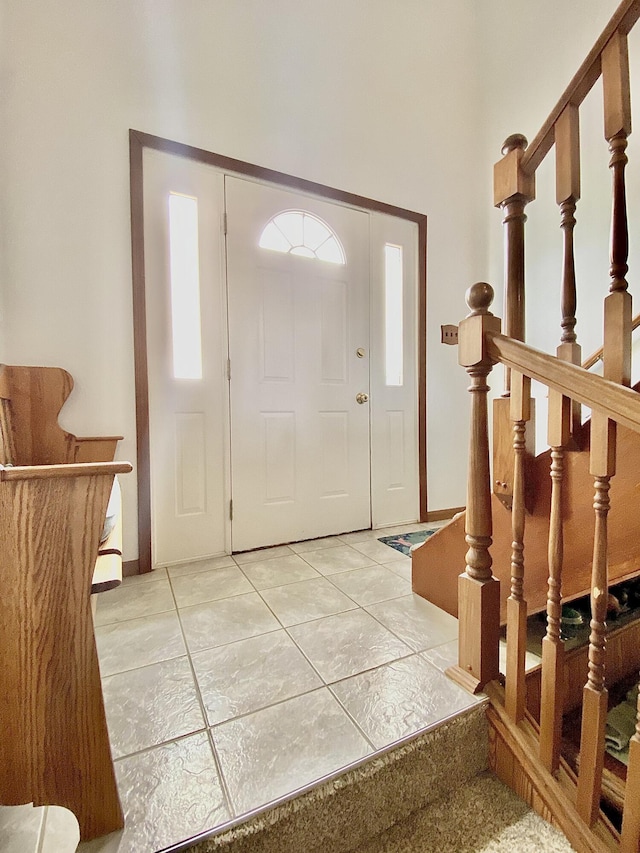 3561 Barber Rd, Hastings, MI 49058 - foyer with stairway and light tile patterned floors