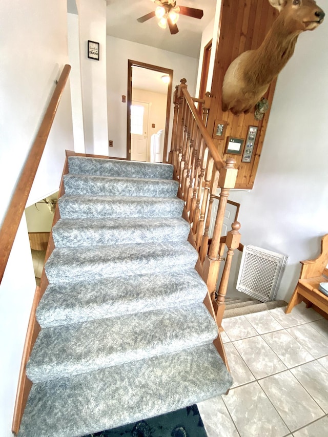 3561 Barber Rd, Hastings, MI 49058 - staircase with a ceiling fan and tile patterned floors