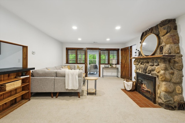 6780 Packer Dr NE, Belmont, MI 49306 - living area with carpet, recessed lighting, and a stone fireplace