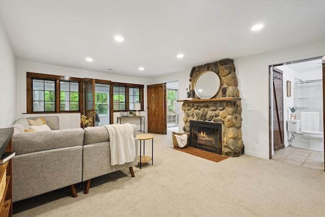 6780 Packer Dr NE, Belmont, MI 49306 - living room featuring a fireplace, light carpet, and recessed lighting