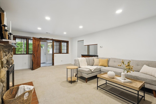 6780 Packer Dr NE, Belmont, MI 49306 - living room with recessed lighting, a stone fireplace, baseboards, and light colored carpet