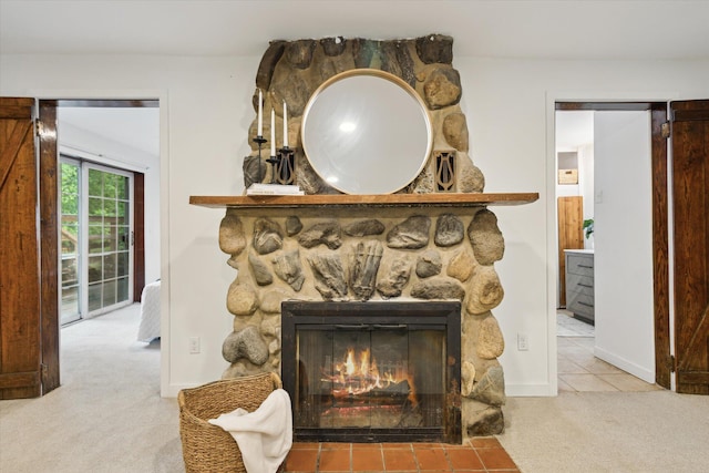 6780 Packer Dr NE, Belmont, MI 49306 - detailed view of carpet, a stone fireplace, and baseboards