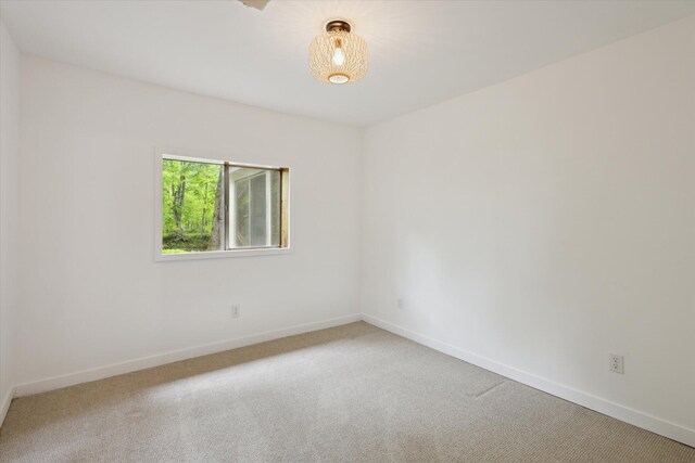 6780 Packer Dr NE, Belmont, MI 49306 - carpeted empty room featuring baseboards
