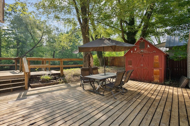 6780 Packer Dr NE, Belmont, MI 49306 - deck featuring outdoor dining space and a fenced backyard