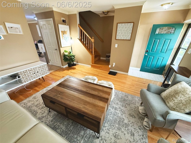 38128 Jamestown Dr, Sterling Heights, MI 48312 - living area with crown molding, stairway, wood finished floors, and baseboards