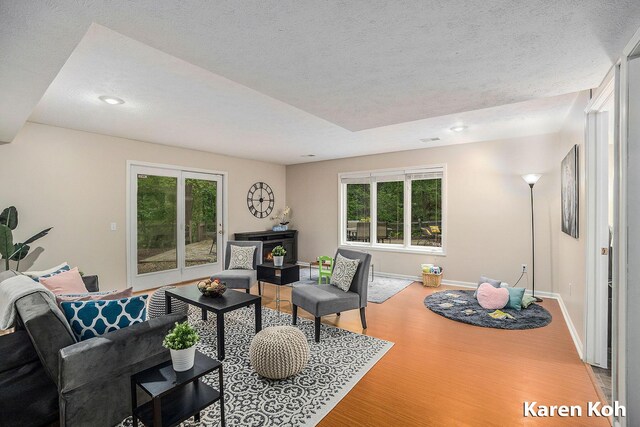 240 Pettis Ave NE, Ada, MI 49301 - living area with wood finished floors, plenty of natural light, baseboards, a textured ceiling, and recessed lighting