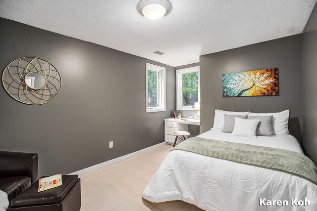 240 Pettis Ave NE, Ada, MI 49301 - bedroom with baseboards and light tile patterned floors