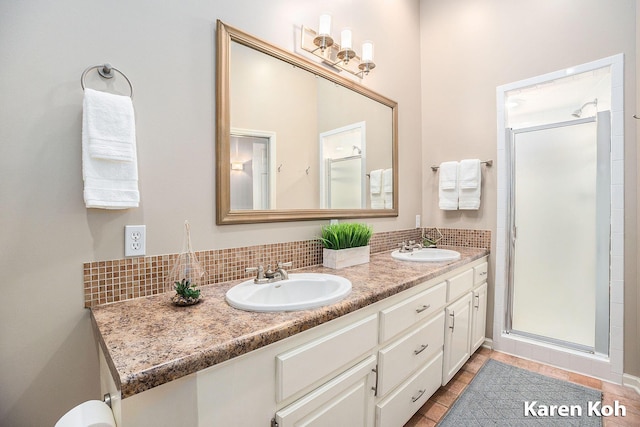 240 Pettis Ave NE, Ada, MI 49301 - full bathroom featuring double vanity, tasteful backsplash, and a shower stall