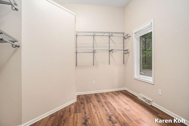 240 Pettis Ave NE, Ada, MI 49301 - walk in closet with wood finished floors