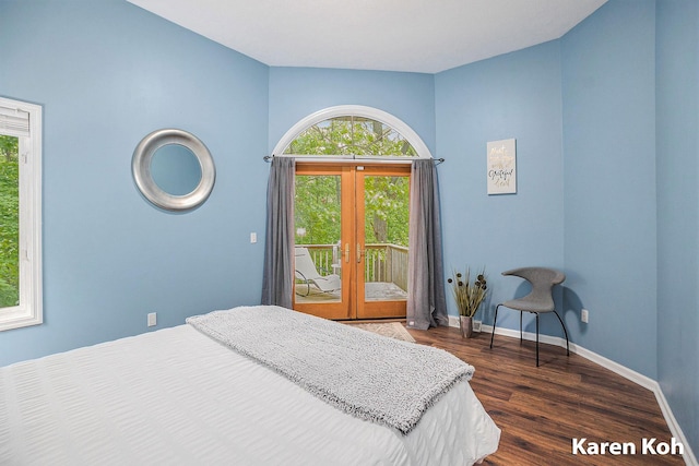 240 Pettis Ave NE, Ada, MI 49301 - bedroom with access to exterior, french doors, dark wood-type flooring, and baseboards