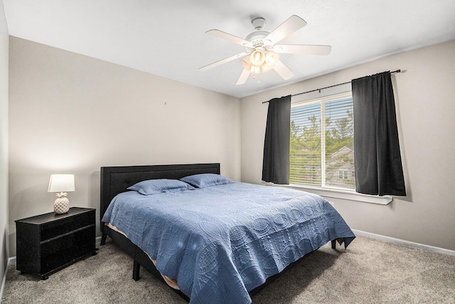 5923 E Lyn Haven Dr SE Unit 45, Grand Rapids, MI 49512 - carpeted bedroom with baseboards and ceiling fan