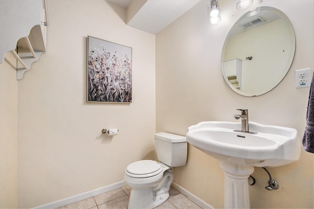 5923 E Lyn Haven Dr SE Unit 45, Grand Rapids, MI 49512 - half bathroom featuring tile patterned flooring, toilet, and baseboards