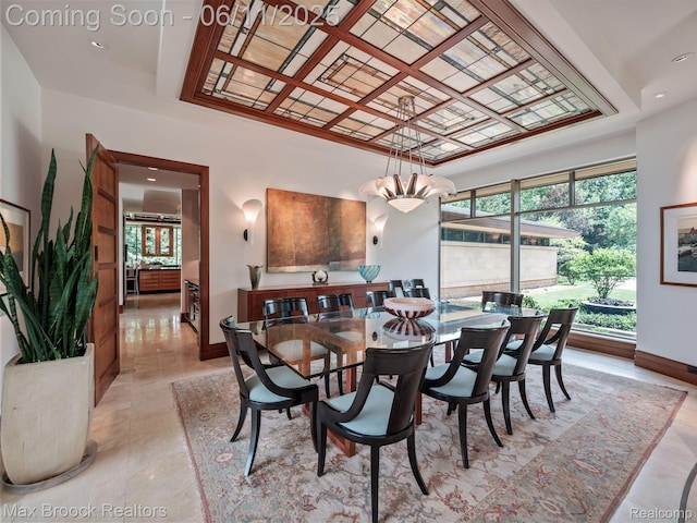 4790 Dow Ridge Rd, Orchard Lake, MI 48324 - dining room with a chandelier, healthy amount of natural light, baseboards, and coffered ceiling