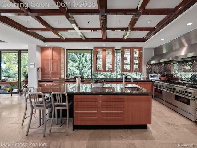 4790 Dow Ridge Rd, Orchard Lake, MI 48324 - kitchen featuring a sink, double oven range, dark stone countertops, tasteful backsplash, and healthy amount of natural light