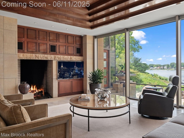 4790 Dow Ridge Rd, Orchard Lake, MI 48324 - living area featuring a water view and a fireplace
