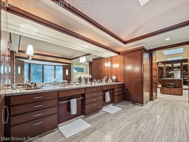 4790 Dow Ridge Rd, Orchard Lake, MI 48324 - bathroom featuring double vanity, a wall mounted air conditioner, lofted ceiling, a tray ceiling, and a chandelier