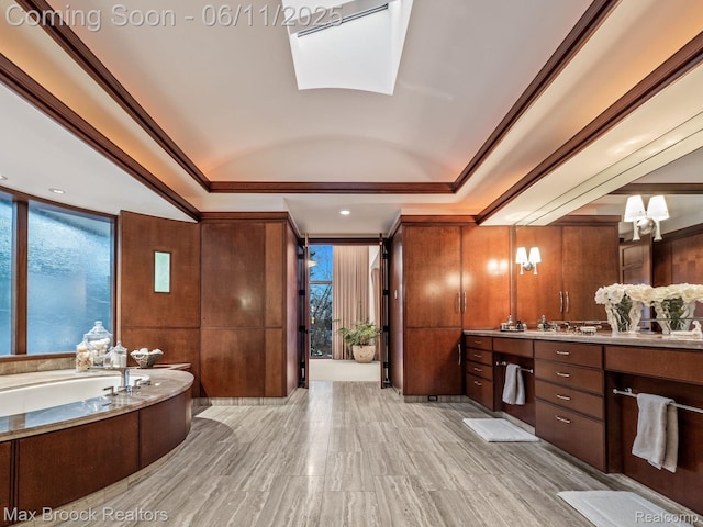 4790 Dow Ridge Rd, Orchard Lake, MI 48324 - bathroom featuring vanity, a tray ceiling, a garden tub, a skylight, and crown molding