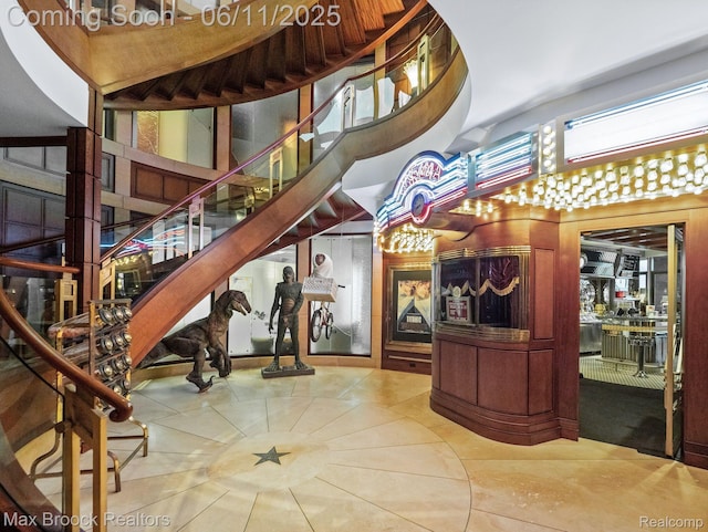 4790 Dow Ridge Rd, Orchard Lake, MI 48324 - staircase featuring tile patterned floors and a high ceiling