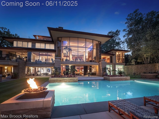 4790 Dow Ridge Rd, Orchard Lake, MI 48324 - swimming pool with a fire pit and a patio