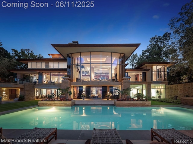 4790 Dow Ridge Rd, Orchard Lake, MI 48324 - rear view of house featuring a balcony and an outdoor pool